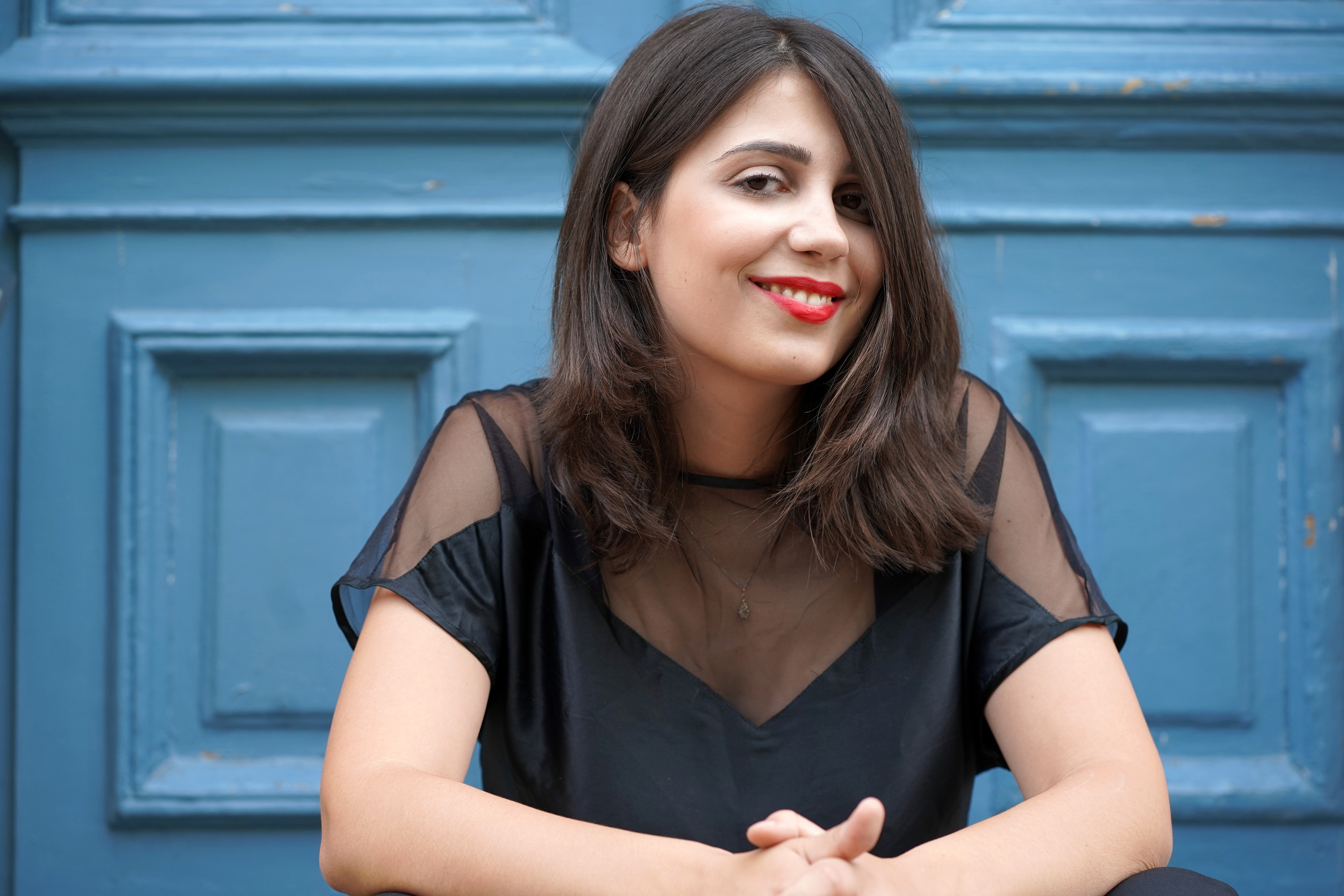 Image of pianist and blue door behind